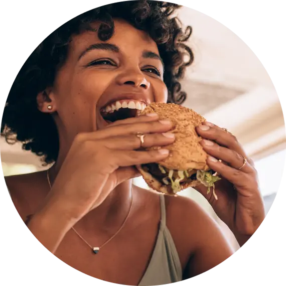 Woman eating waygu beef burger